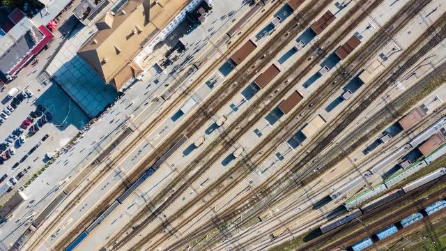 train station top view of trains and people hyperlapse from drone