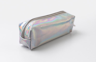 Holographic silver pencil case on white background.
