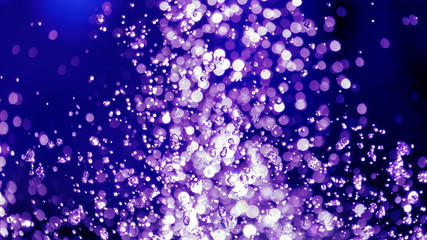 the blurred drops of water spray fountain