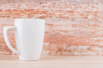 White ceramic cups on wooden background, image