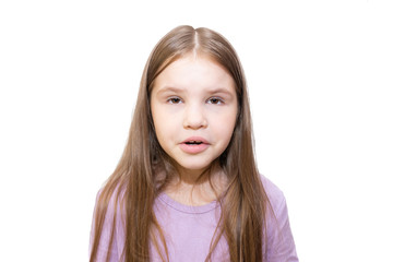 The little girl really wants to sneeze. Isolated on a white background.