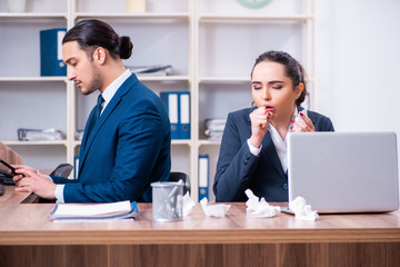 Two employees suffering at workplace