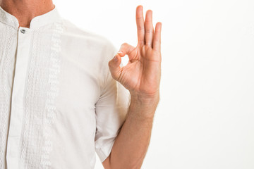 Man performing various yoga hand gestures called 