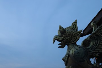 statue of angel on roof of building
