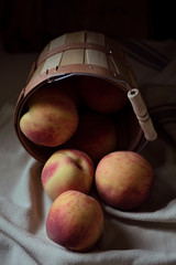 Peaches in basket on table - 284043053