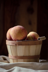 Fresh peaches in a basket - 284043083
