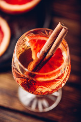Orange whiskey sour cocktail with bourbon, blood orange juice and simple syrup