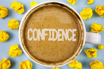 Conceptual hand writing showing Confidence. Business photo text Never ever doubting your worth, inspire and transform yourself written Coffee in Cup within Paper Balls plain background.
