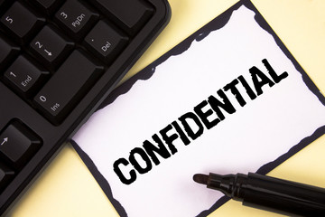 Conceptual hand writing showing Confidential. Business photo text Agreements between two parties are private and protected written Sticky Note paper plain background Marker Keyboard.