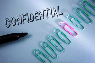 Handwriting text Confidential. Concept meaning Agreements between two parties are private and...