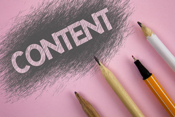 Text sign showing Content. Conceptual photo Website containing exclusive and containing rich information written Pink background Pen and pencils next to it.