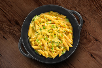Traditional Italian pasta on black rustic pan