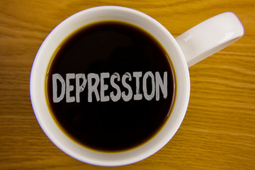 Word writing text Depression. Business concept for Work stress with sleepless nights having anxiety disorder written Black Tea in White Cup placed wooden table. Top view.