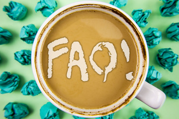 Word writing text Faq Motivational Call. Business concept for Frequently asked question for clearing up confusions written Tea in White Cup within Crumpled Paper Balls plain background.