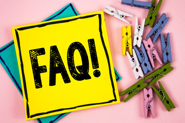 Text sign showing Faq Motivational Call. Conceptual photo Frequently asked question for clearing up confusions written Sticky Note Paper plain background Paper Balls and Wooden Clips.