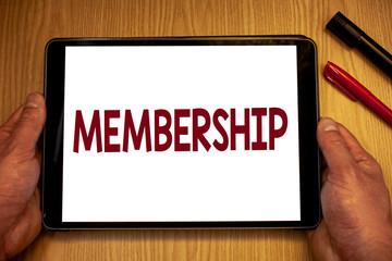 Text sign showing Membership. Conceptual photo Being member Part of a group or team Join an organizationMan hold holding table with ideas words white screen black red pens wooden