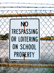 Naklejka premium No Trespassing or Loitering on School Property Metal Sign