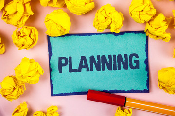 Writing note showing Planning. Business photo showcasing Defining strategies for achieving a goal Process of making plans written Sticky note paper within paper balls plain background Pen