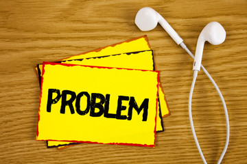 Word writing text Problem. Business concept for Trouble that need to be solved Difficult Situation Complication written Yellow Sticky Note Paper wooden background Handsfree next to it.