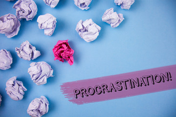 Word writing text Procrastination Motivational Call. Business concept for Delay or Postpone something boring written the Painted background Crumpled Paper Balls next to it.