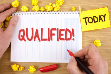 Text sign showing Qualified Motivational Call. Conceptual photo Certified to perform a job Competent Experienced written by Man Notepad holding Marker wooden background Today Paper Balls,