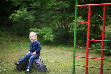 Cute little girl playing on the playground