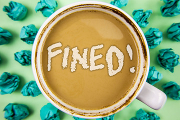 Word writing text Fined Motivational Call. Business concept for No penalty charge for late credit card bill payment written Tea in White Cup within Crumpled Paper Balls plain background.