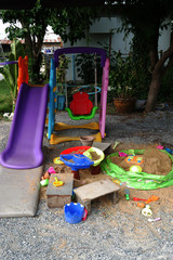 colorful mini slider of plastic for kid in playground on backyard.
