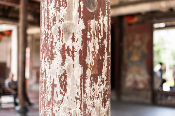 aged wooden pillar with crack paint