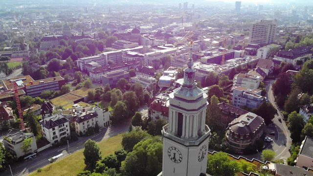 Scenic drone aerial of Z&uuml;rich the biggest City in Switzerland on a sunny summer day. The shot is slowly moving down a church in the town. Shot located in district 6, Fluntern.