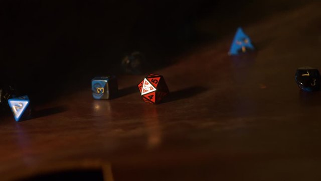Slow Motion Dice Roll of various Dice with smoke. 4k
