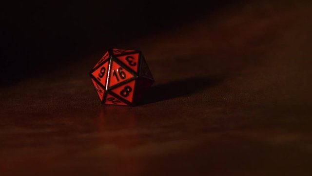 Slow Motion Dice Roll of a D20 with smoke. 4k