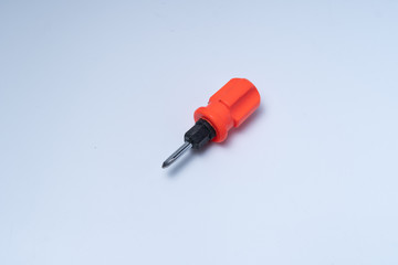 Mini philip screwdriver with orange handle isolated on white background.