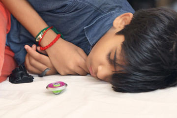 Obraz na płótnie Canvas Indian Little boy sleeping on bed