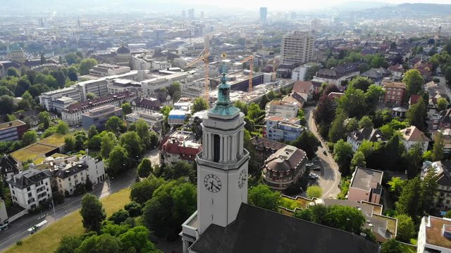 Beautiful drone aerial of Z&uuml;rich, the biggest city in Switzerland. Quarter drone orbit around a church in the region of Fluntern.