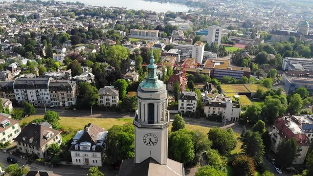 Beautiful drone aerial of Z&uuml;rich, the biggest city in Switzerland. The shot is moving around a church in Fluntern.