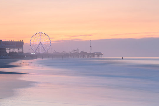 Luna park on the pier  in Atlantic City at sunrise with long exposure