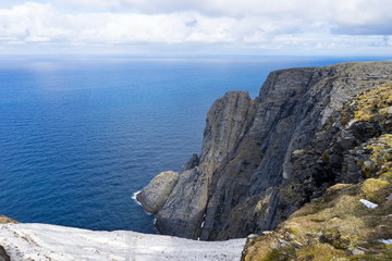 Majestic steep cliff view from the northcape, in northern Norway