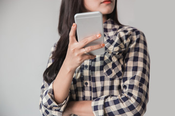 cropped image of asian woman using smartphone on white background