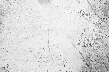 Texture of a concrete wall with cracks and scratches which can be used as a background
