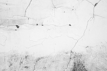 Texture of a concrete wall with cracks and scratches which can be used as a background