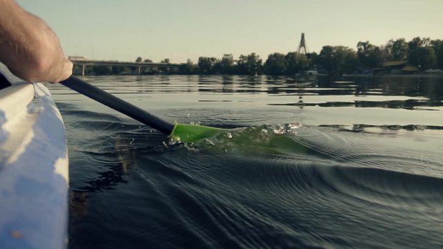 Paddle Rowing On A Quiet River At Sunset In Slow Motion.Kayak Paddle Rowing.Oar Canoe.Close-up Of A Paddle Boat At Dawn.Paddle In The Water. Water Splashes.