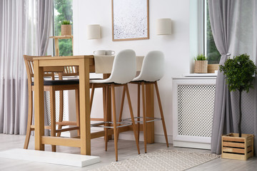 Modern room interior with wooden dining table