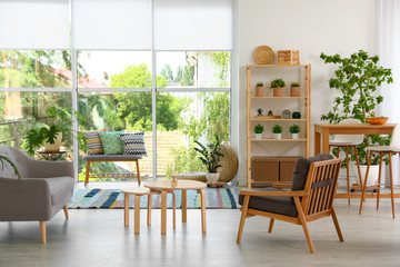 Modern living room interior with comfortable couch and wooden furniture