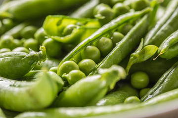 Fresh green pea seeds and pods - Close up