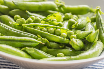 Fresh green pea seeds and pods - Close up