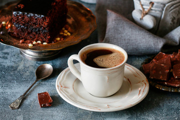 Cup of coffee and traditional brownie with chocolate