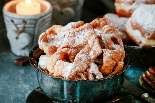 Fat Thursday celebration - traditional Angel Wings cookies decorated with powdered sugar.