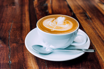 Coffee milk latte on wood table at coffee shop for drink in coffee time