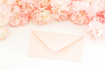 Love letters and carnation flowers, romantic decoration in pastel colors.